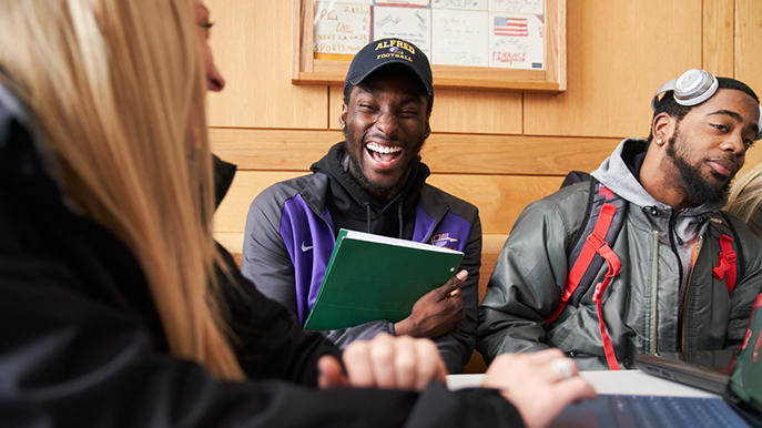 Student laughing with other students